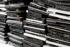 Four columns of closed laptops stacked on top of each other