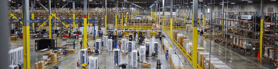 View of the WWT North American Integration Center warehouse located in Edwardsville, IL with equipment and storage shelves.