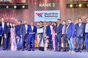Group of employees on stage accepting an award, standing beneath a screen displaying the World Wide Technology logo and "Rank 3" recognition at an industry workplace awards ceremony. 